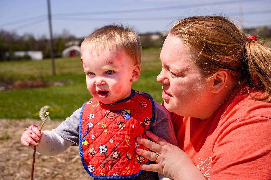 A photo of Matthew and his mother at the park.