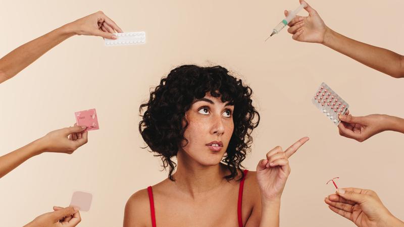 A woman is choosing from a variety of options.