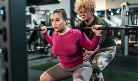 Two women weightlifting