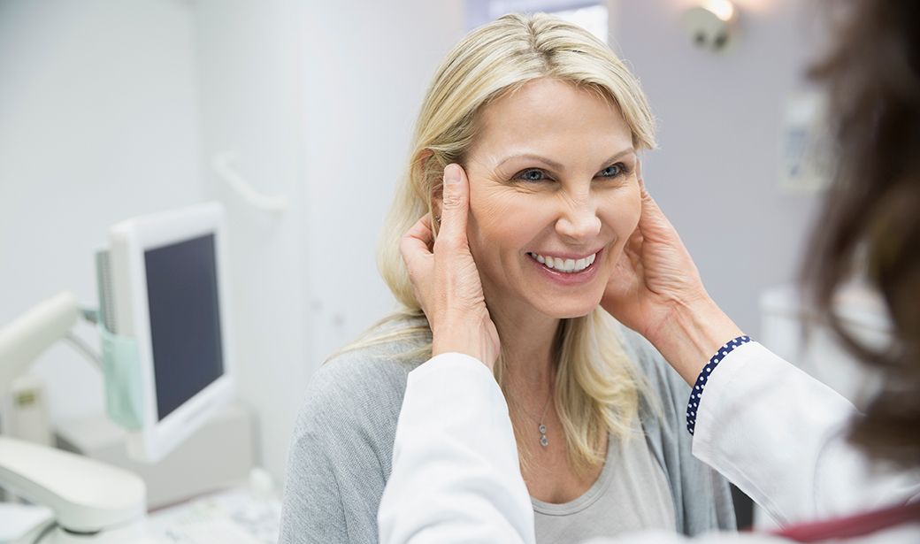 Woman at plastic surgeon