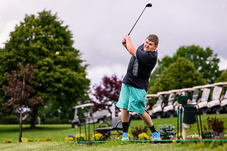 A man playing golf.