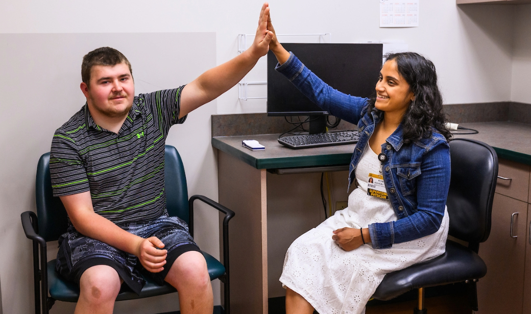 A man and a woman giving a high five.