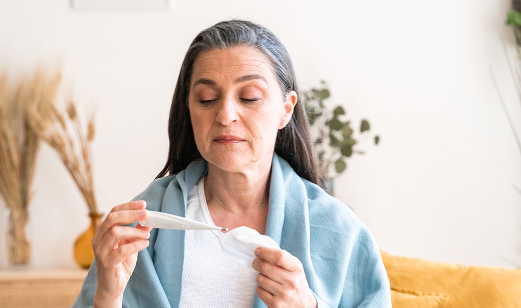 Woman reading a thermometer