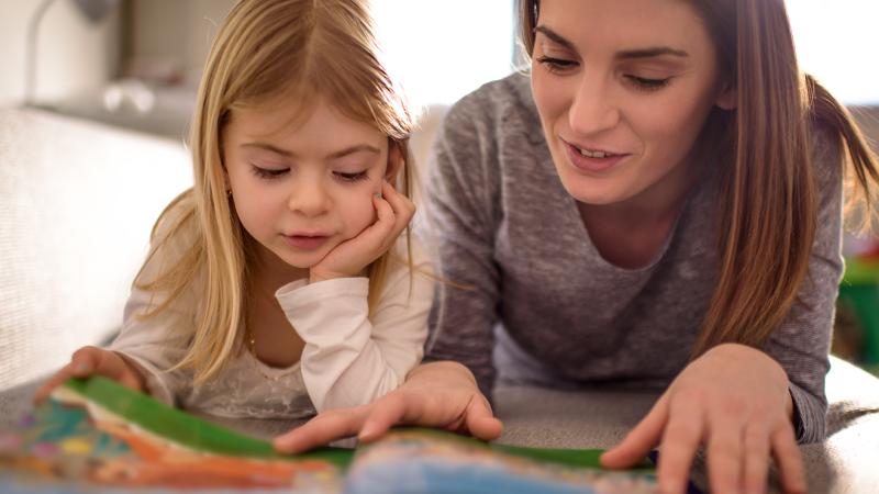 mother and child reading together