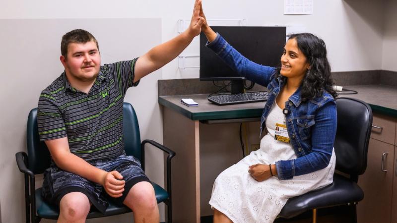 A man and a woman giving a high five.