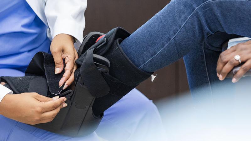 person getting an orthopaedic boot