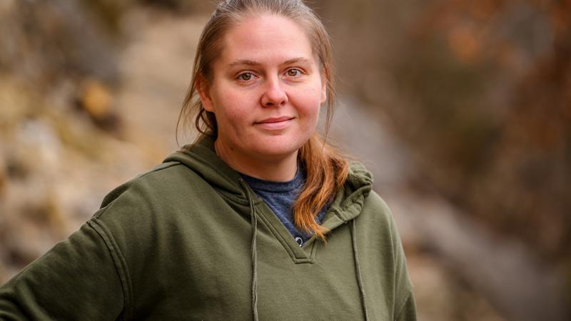 A photo of a woman outdoors.