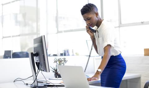 woman standing while working