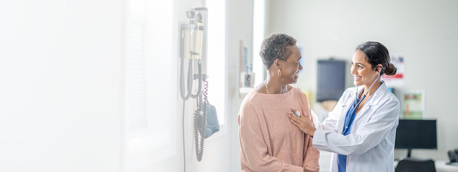 A patient and a physician talking.